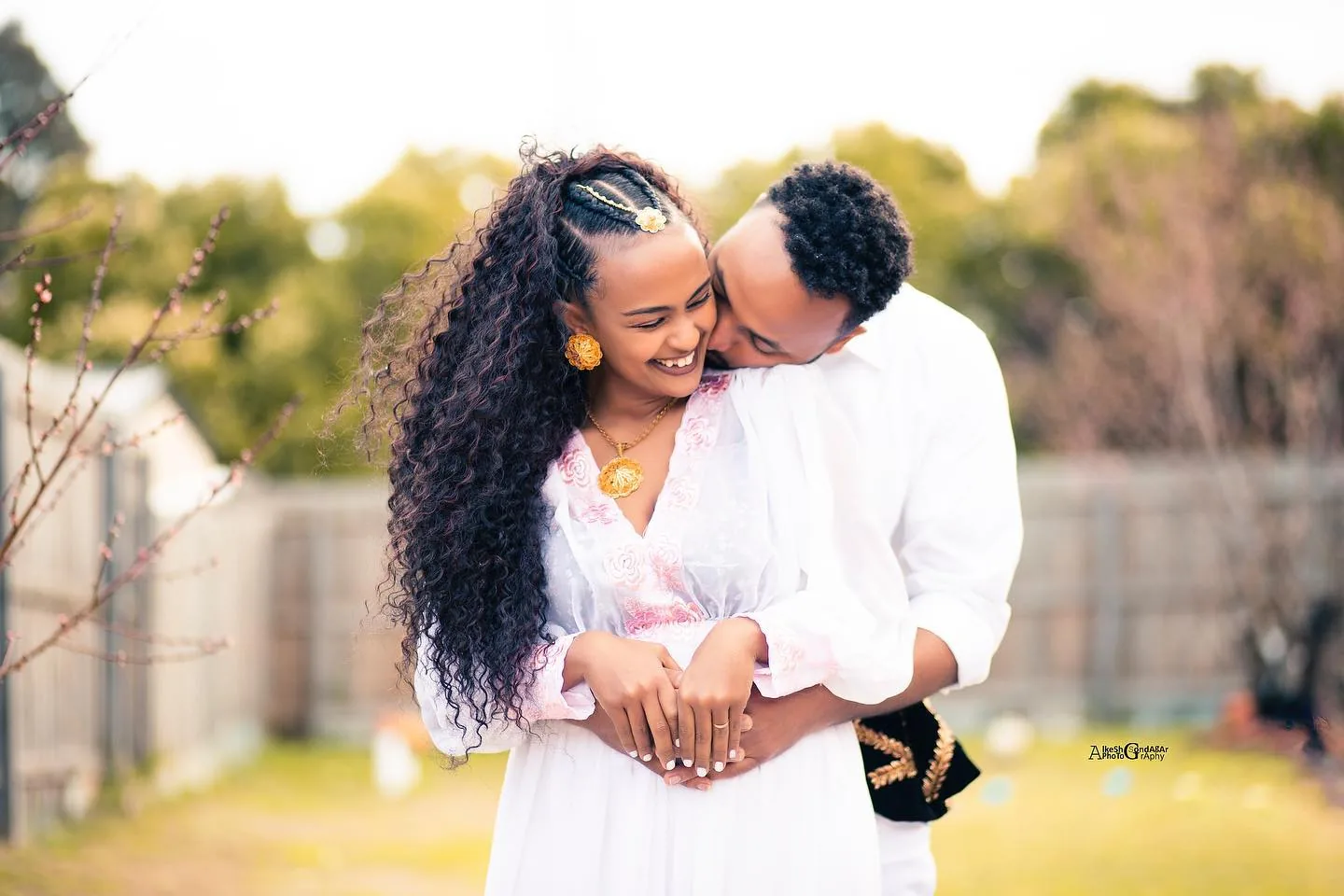 Pre-session couple frame in bright outdoor light